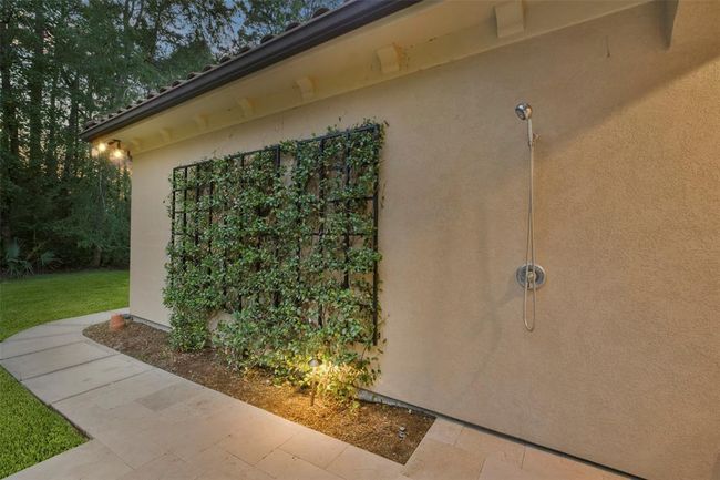 Enjoy the luxury of a private outdoor shower, nestled in a serene garden setting, perfect for refreshing moments in nature and is ready for your future pool | Image 44