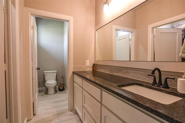 Bathroom with toilet and vanity | Image 23