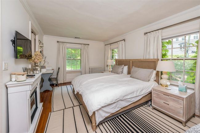 Primary bedroom with relaxing electric fireplace. | Image 20