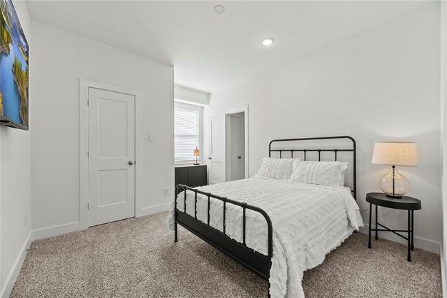 Spacious secondary bedrooms offer ample closet space and direct access to a full bathroom. | Image 15