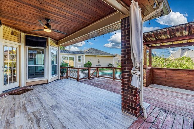 Safety first! You can breathe easy knowing that there is a gate between the covered patio and the pool for any little ones or animals that need supervision. | Image 37