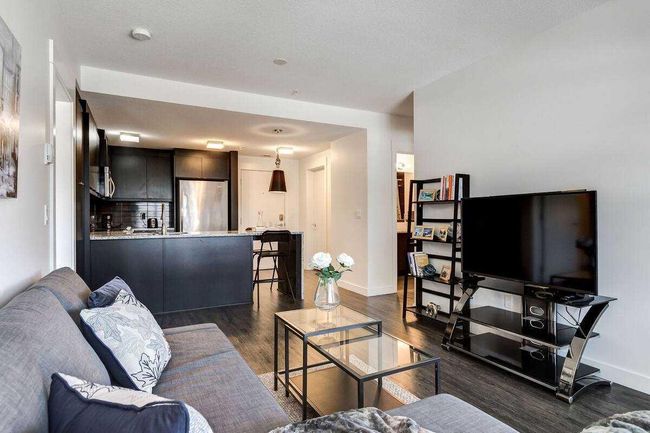 104 - 15 Aspenmont Heights Sw, Home with 2 bedrooms, 2 bathrooms and 1 parking in Calgary AB | Image 1