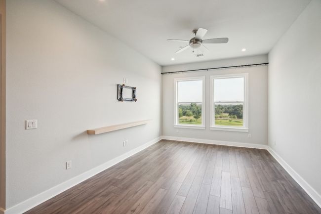 Spare room with dark wood finished floors, a ceiling fan, baseboards, and recessed lighting | Image 6