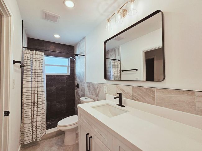 New Vanity, Toilet, Fixtures & Newly Tiled Shower | Image 26