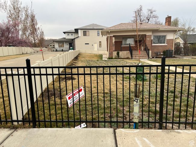 View of yard featuring cooling unit and a fenced front yard | Image 29