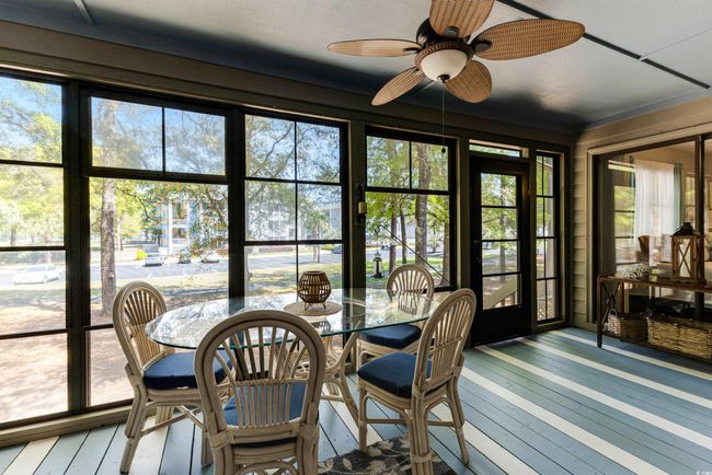 Sunroom / solarium with a wooden deck and wood-type flooring | Image 10