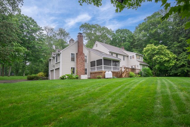 Rear view of home showing Screened-in Porch and Generac System with 2 120-Gallon Propane tanks (owned) | Image 4
