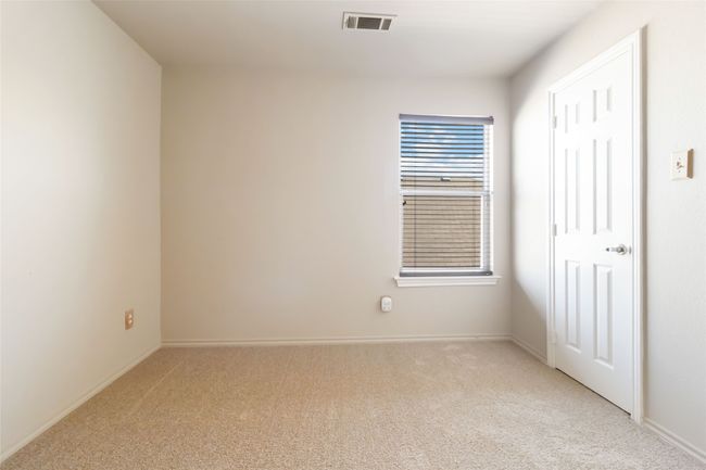 Empty room featuring baseboards, visible vents, and light carpet | Image 15