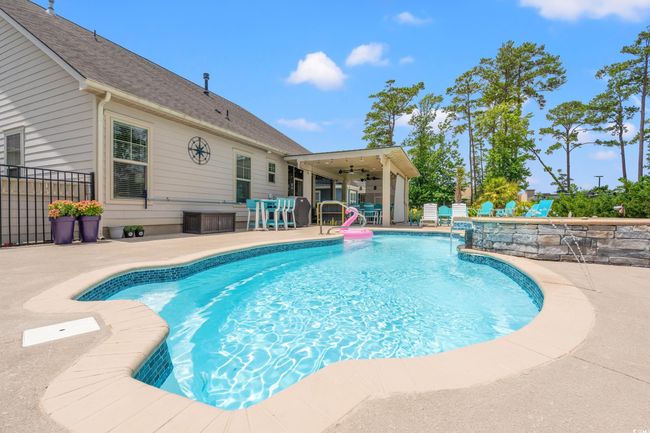 Outdoor pool with a patio and a ceiling fan | Image 34