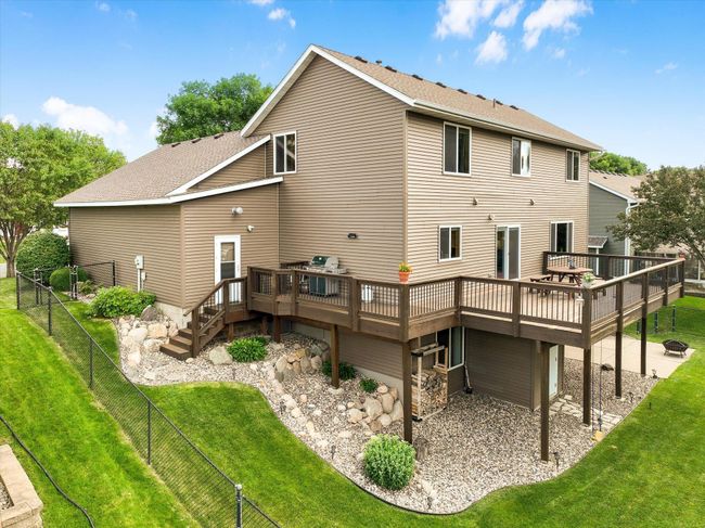 Incredible landscaping, irrigated fenced yard, deck, patio, and 2 storage sheds! | Image 51