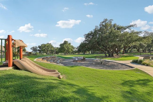 View of home's community with a lawn and playground community | Image 31