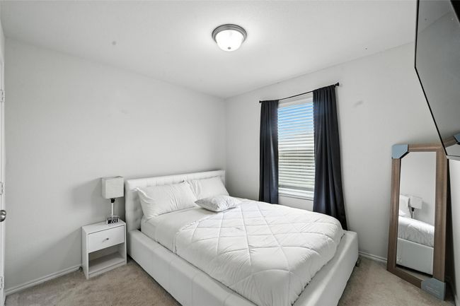Bedroom with carpet floors and baseboards | Image 14