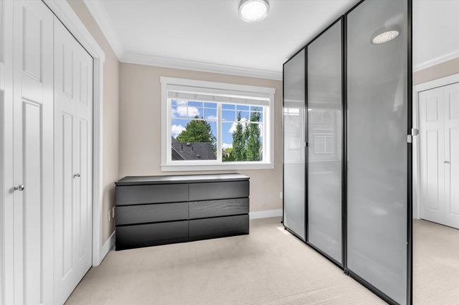 Unfurnished bedroom featuring light carpet and crown molding | Image 20