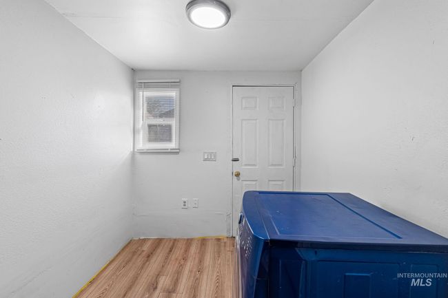 Washroom with light wood-type flooring | Image 17