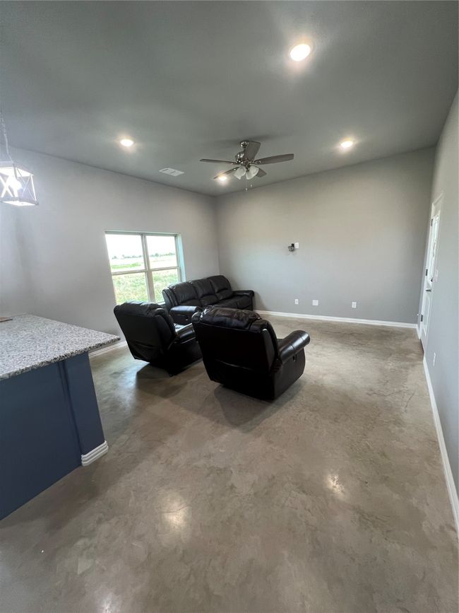 Mother-in -law Living room featuring stained concrete floors | Image 27