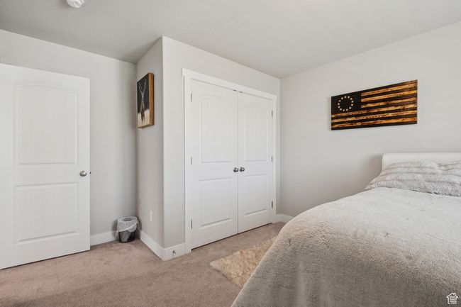 Carpeted bedroom featuring baseboards and a closet | Image 26