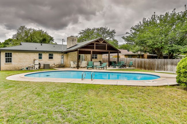 swimming pool with a patio area | Image 35