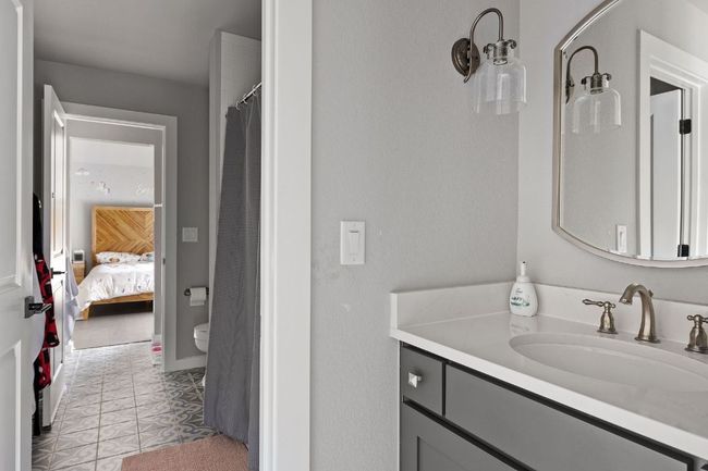 Ensuite bathroom with tile patterned flooring, vanity, a shower with curtain, and ensuite bathroom | Image 36