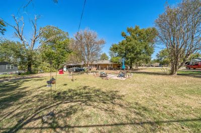 View of yard with a fire pit | Image 2