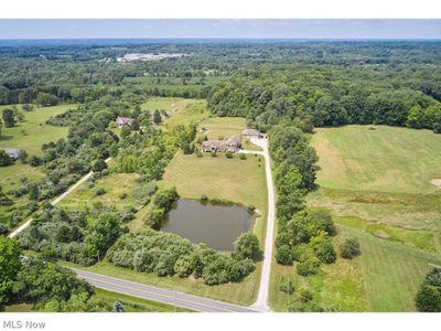 Birds eye view of property featuring a water view | Image 1