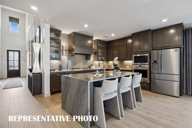 Featuring outstanding storage and prep space, the chef in the family will fall in love with this dream kitchen! REPRESENTATIVE PHOTO | Image 5