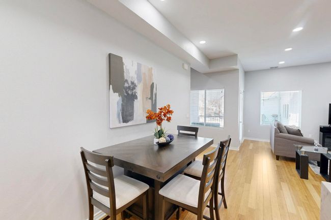 Dining room with light wood-style flooring, recessed lighting, and baseboards | Image 7
