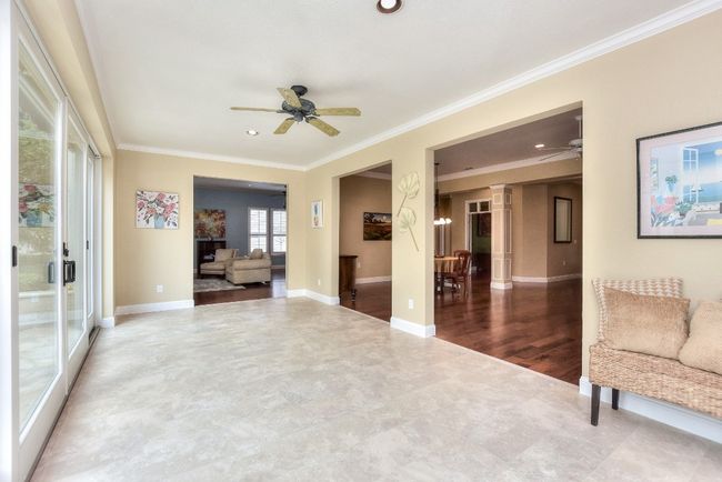 Sun room addition with luxury vinyl flooring, Anderson windows and sliding doors. | Image 6