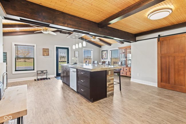kitchen with lofted ceiling with beams, and ceiling fan | Image 12