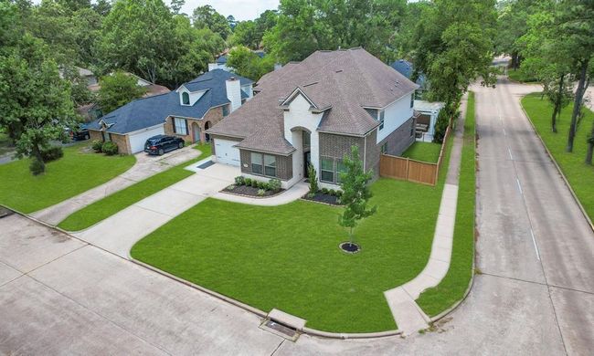 Enjoy the expansive front yard, perfect for outdoor activities or curb appeal. | Image 5