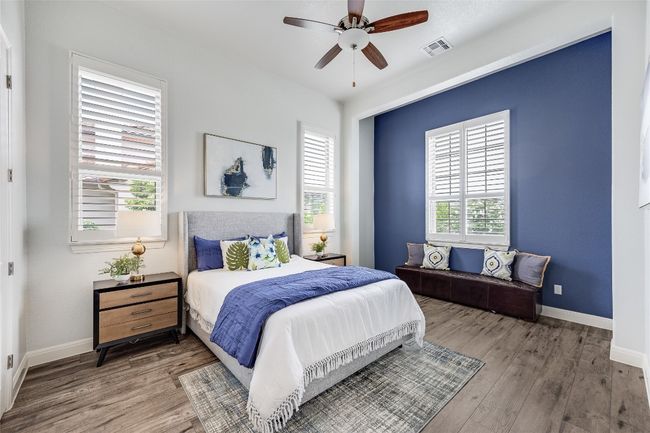 Casita Bedroom with wood finished floors and ceiling fan | Image 24