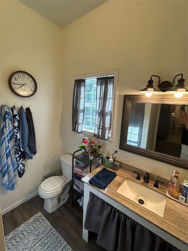 Bathroom featuring wood finished floors and vanity | Image 11
