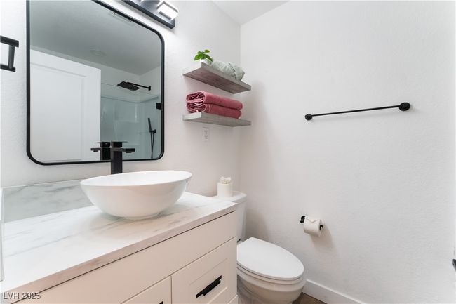 Full bathroom with vanity, toilet, and walk in shower | Image 27