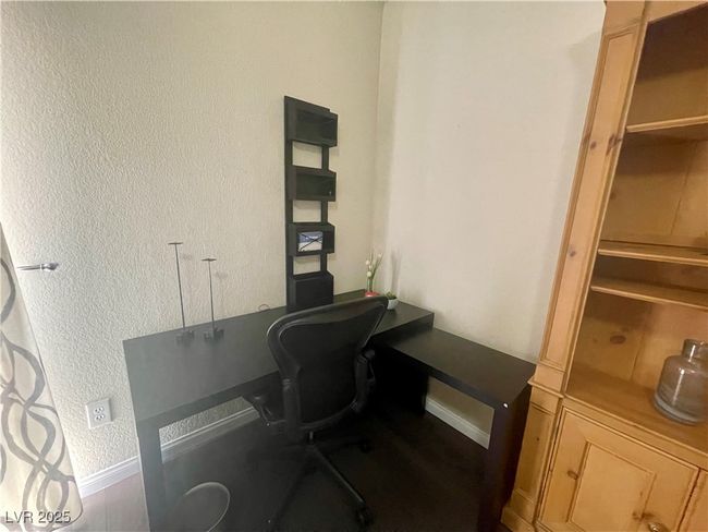 Office area with a textured wall and baseboards | Image 30