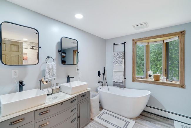 Enjoy this fantastic master bath with double sinks and a highly sought after free-standing tub. | Image 22