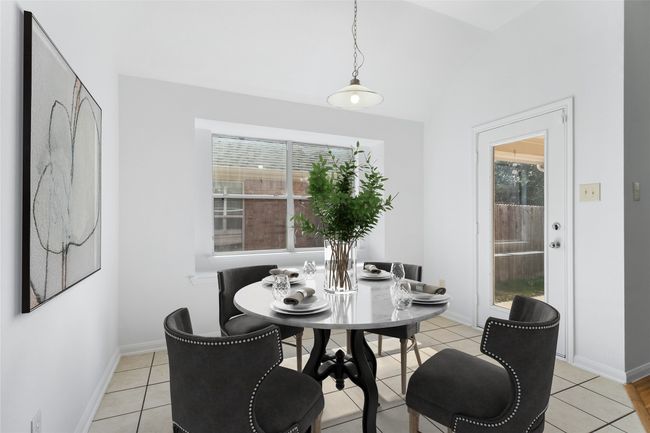 Dining area with plenty of natural light, vaulted ceiling, and light tile patterned floors | Image 10