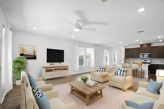 Living area featuring recessed lighting, light wood-type flooring, and ceiling fan | Image 9