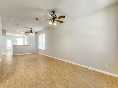 Unfurnished room with light wood-type flooring and ceiling fan | Image 3