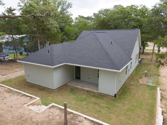 A stunning aerial view of a beautiful home, perfectly set on nearly an acre of land. | Image 33
