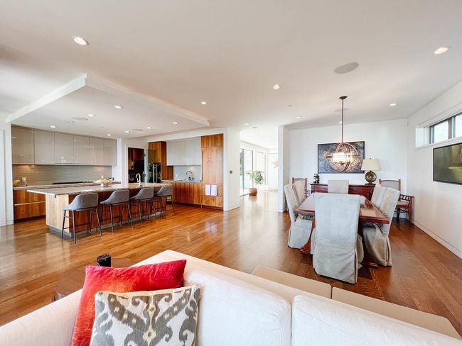 Living area featuring light wood-style flooring, recessed lighting, a chandelier, and baseboards | Image 10