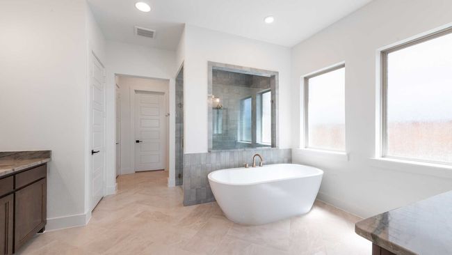 Bathroom featuring a soaking tub, visible vents, baseboards, recessed lighting, and tiled shower | Image 17