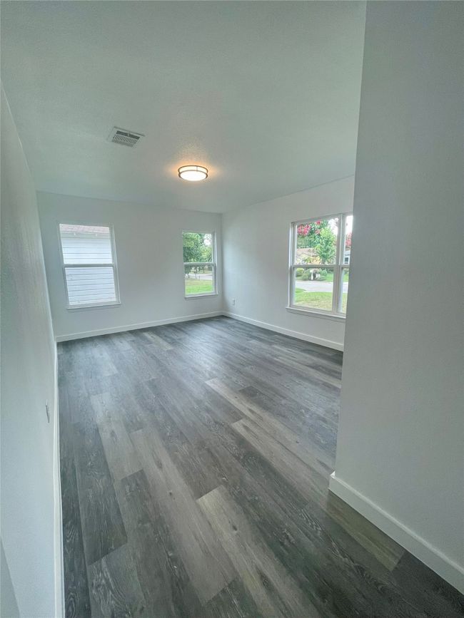 Empty room featuring dark wood-style flooring | Image 10