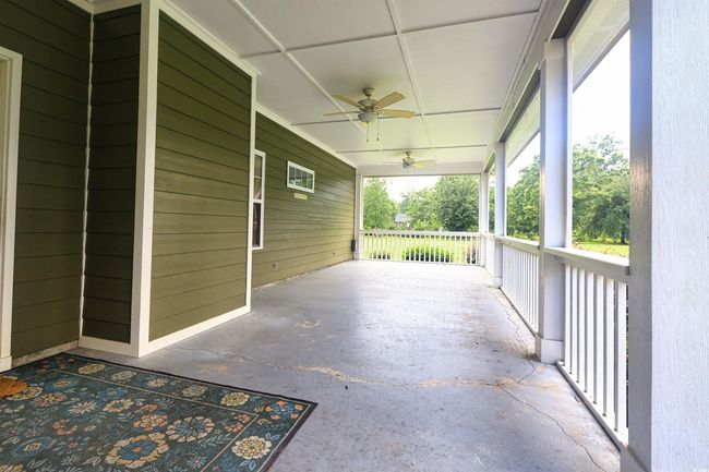 Porch featuring ceiling fan | Image 23