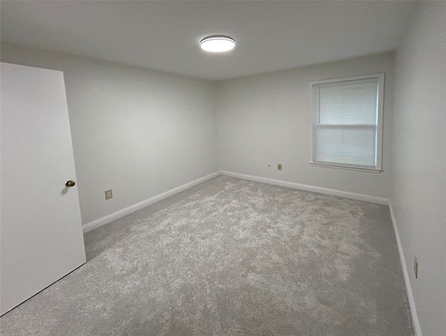 View of carpeted spare room | Image 29