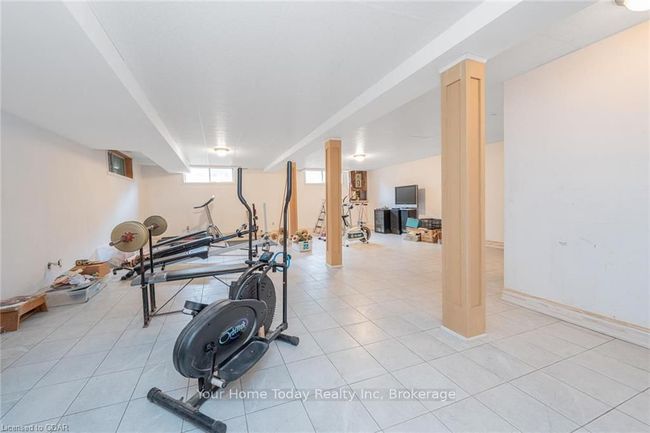 Workout room featuring light tile patterned flooring | Image 32