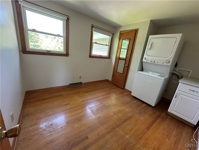 Bedroom that the current owner used as a first floor laundry due to mobility issues with stairs. | Image 12