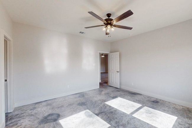 Unfurnished room featuring baseboards, a ceiling fan, and visible vents | Image 21