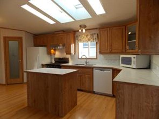 77 - 5210 65 Ave, Home with 3 bedrooms, 2 bathrooms and 3 parking in Olds AB | Image 9