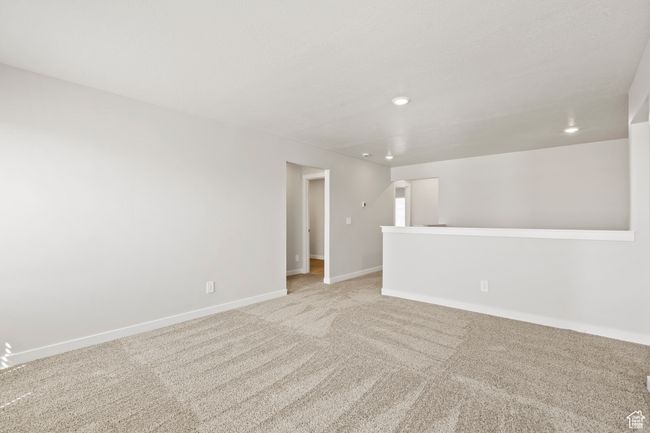 Carpeted empty room with recessed lighting and baseboards | Image 27