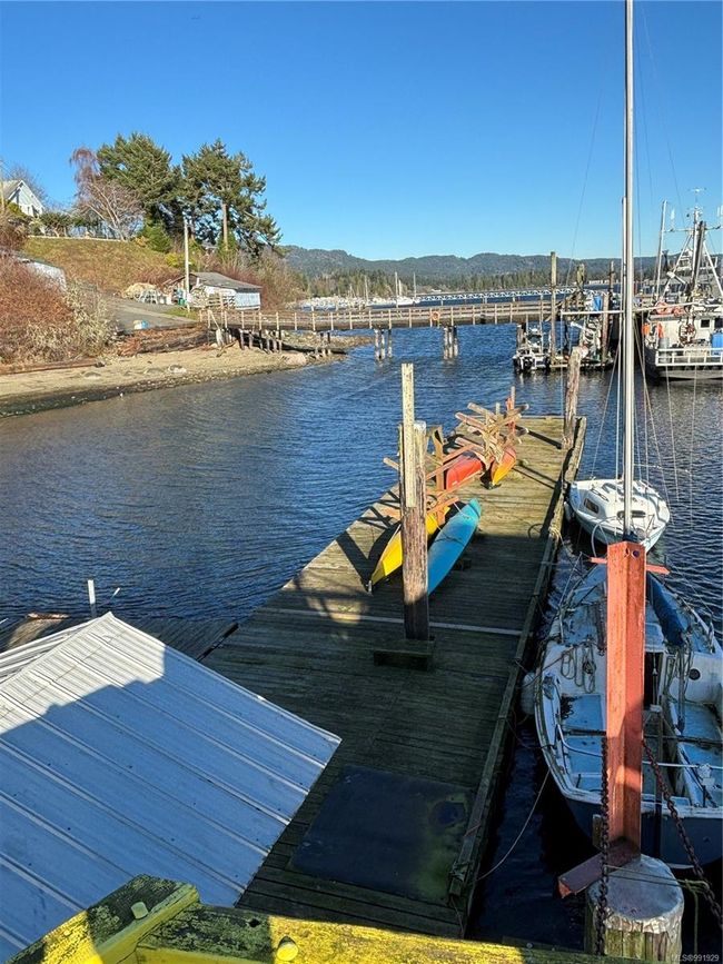 Wharf area with a water and mountain view | Image 31