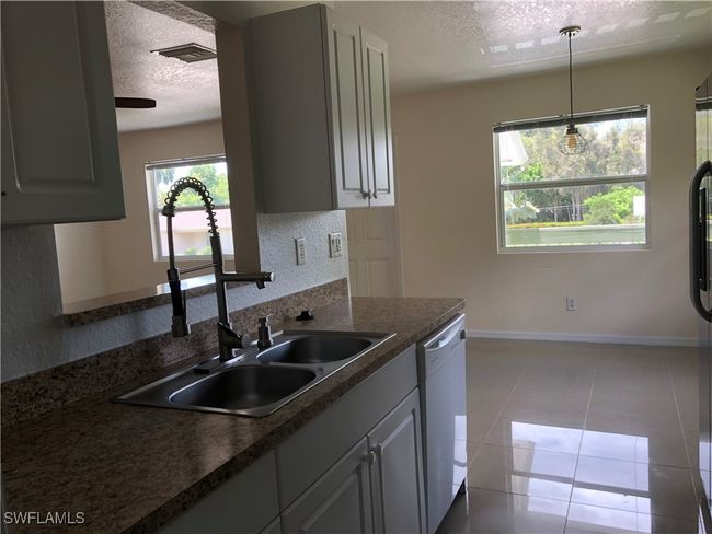 5615 Birdsong Ln, Home with 4 bedrooms, 2 bathrooms and null parking in BOKEELIA FL | Image 13
